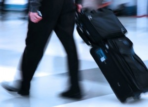 Man rushing through an airport terminal