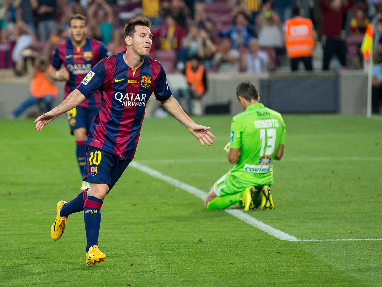 Lionel Messi celebrating scoring a goal against Granada CF in October 2014. Author: L. F. Salas